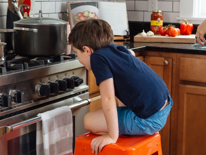 Boy cooking pasta